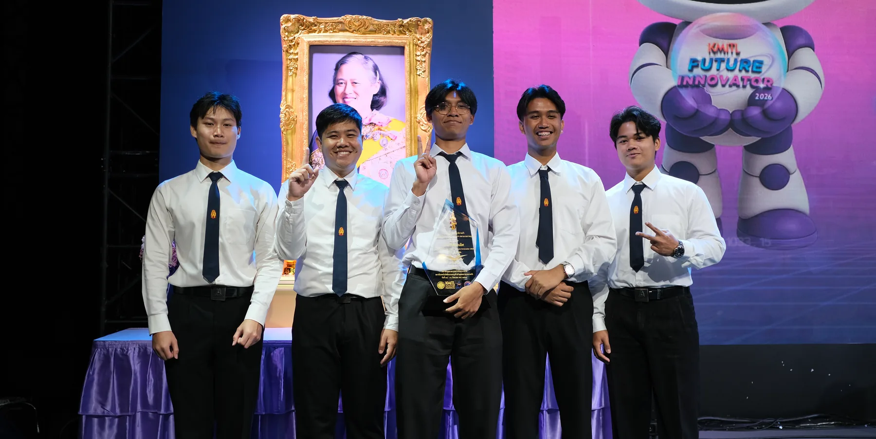 The winning team on stage with the AAVC 2026 trophy